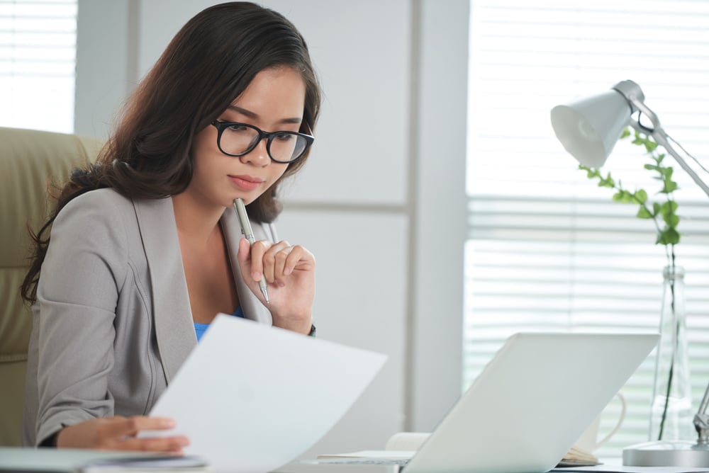 Business Woman Reading Report